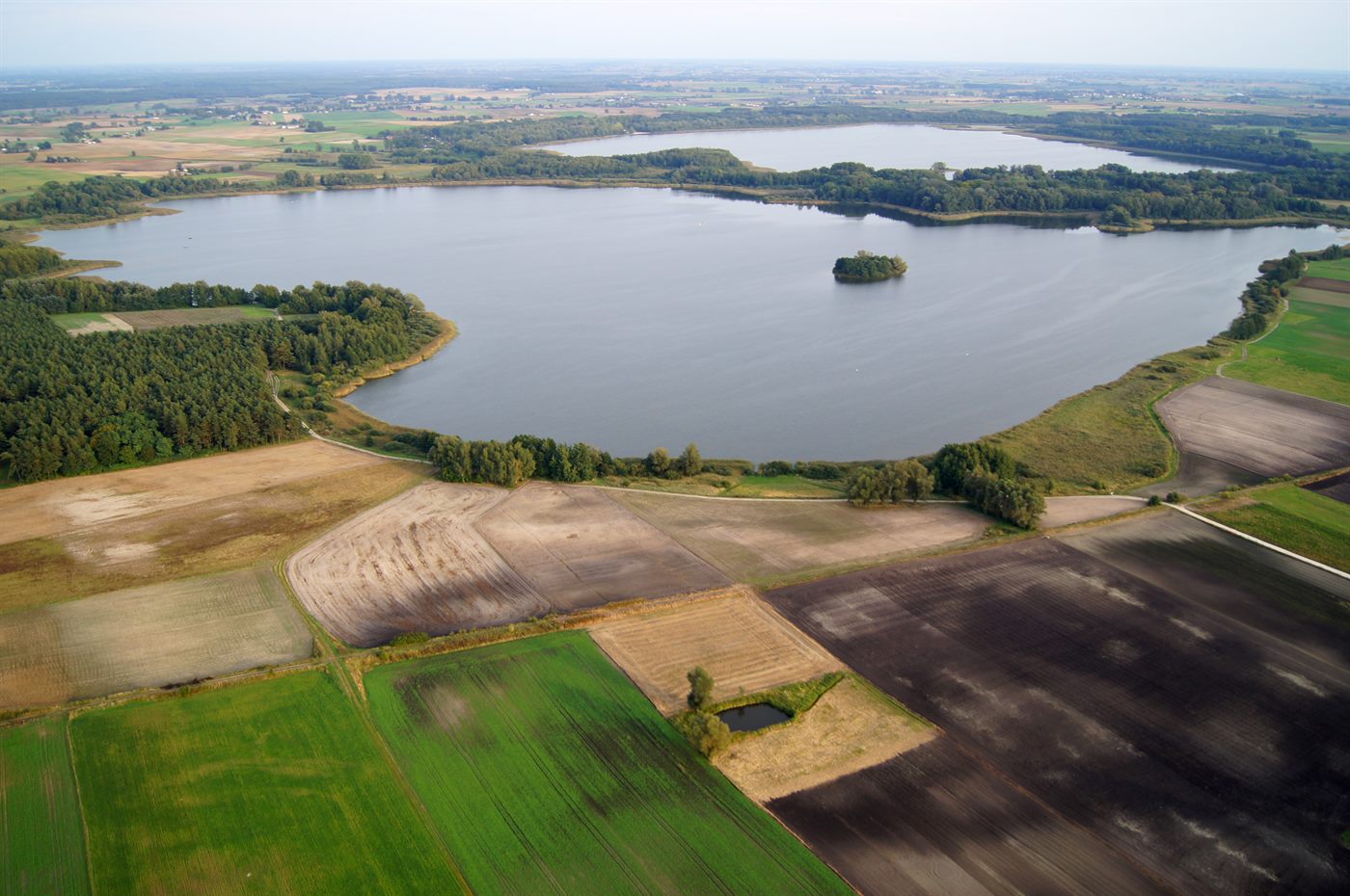 Aerial view of the Wieczno Lake complex surrounded by fields